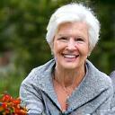 Portrait of Patricia, an elegant senior woman engaging in community gardening.